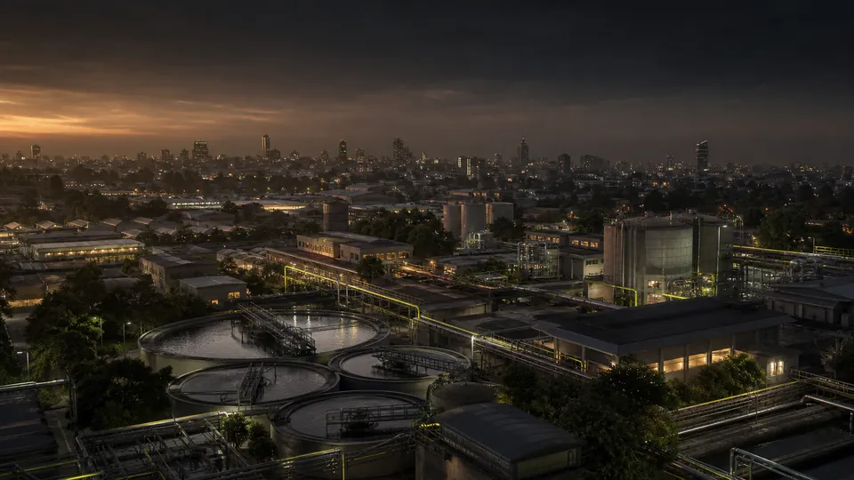 Conceptual dusk view of Nairobi industrial infrastructure with utility tanks and pipework.